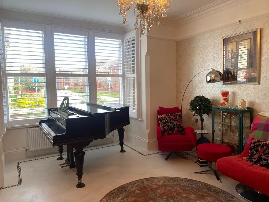 Bay window shutters in a York living room