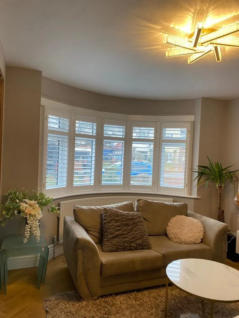 Full-height plantation shutters in a York living room