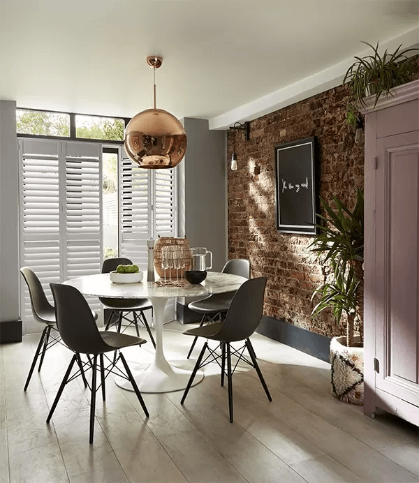 Stylish dining room with plantation shutters