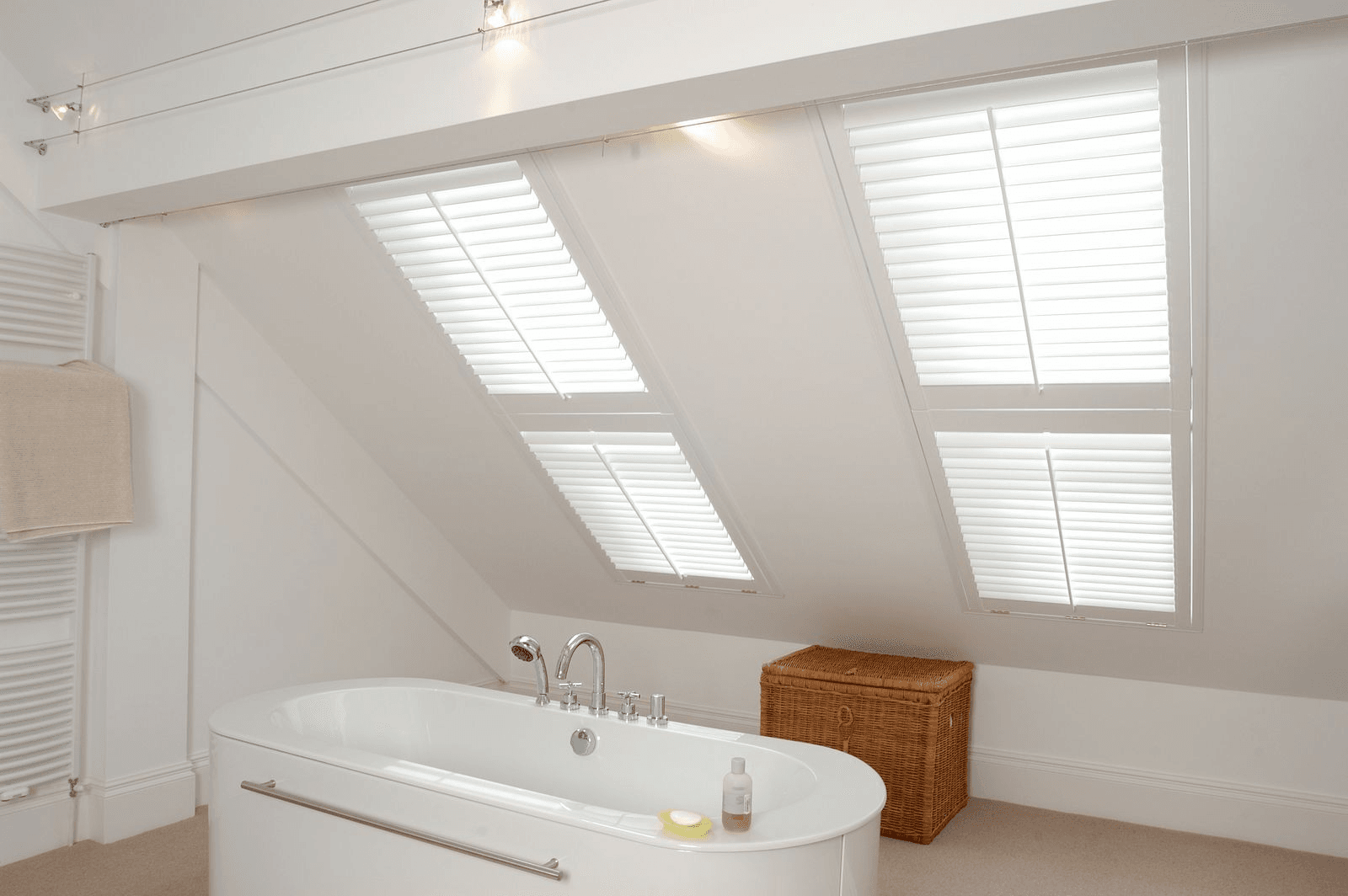 White shutters in a bathroom with skylights